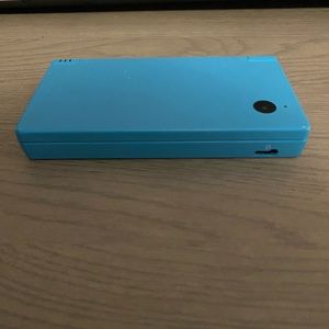 Nintendo ds light blue console with charger
